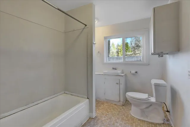 a view of an empty room and wooden floor