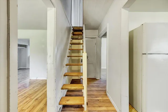 a kitchen with granite countertop cabinets stainless steel appliances and a counter space