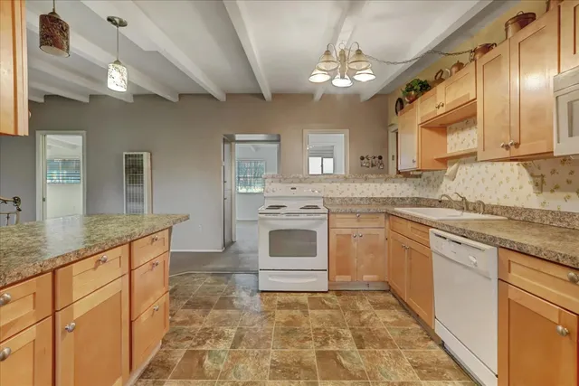 a view of a backyard of the house