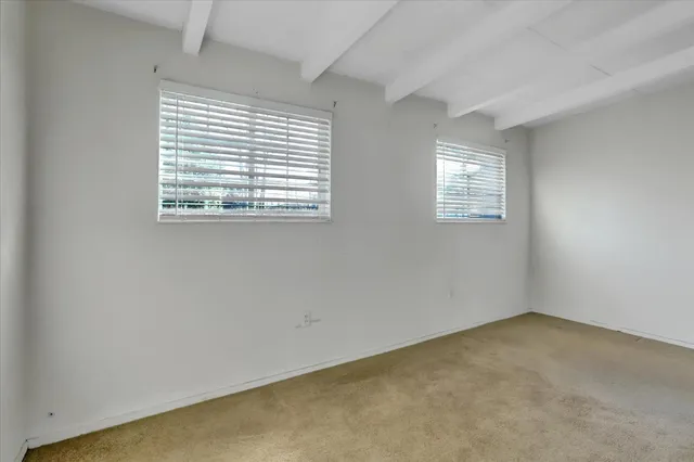 a view of a house with a yard and garage