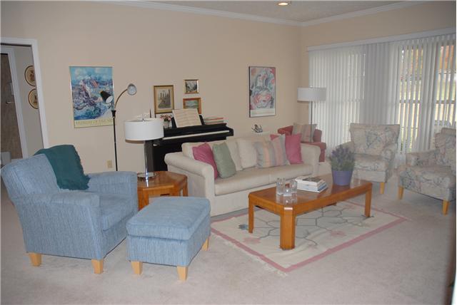 113 Hunters Ridge Drive Tullahoma, TN 37388 - Photo 1 of 14 As you step into the foyer you see the spacious living room featuring large windows and a fireplace.