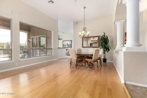 a view of a dining room with furniture window and wooden floor