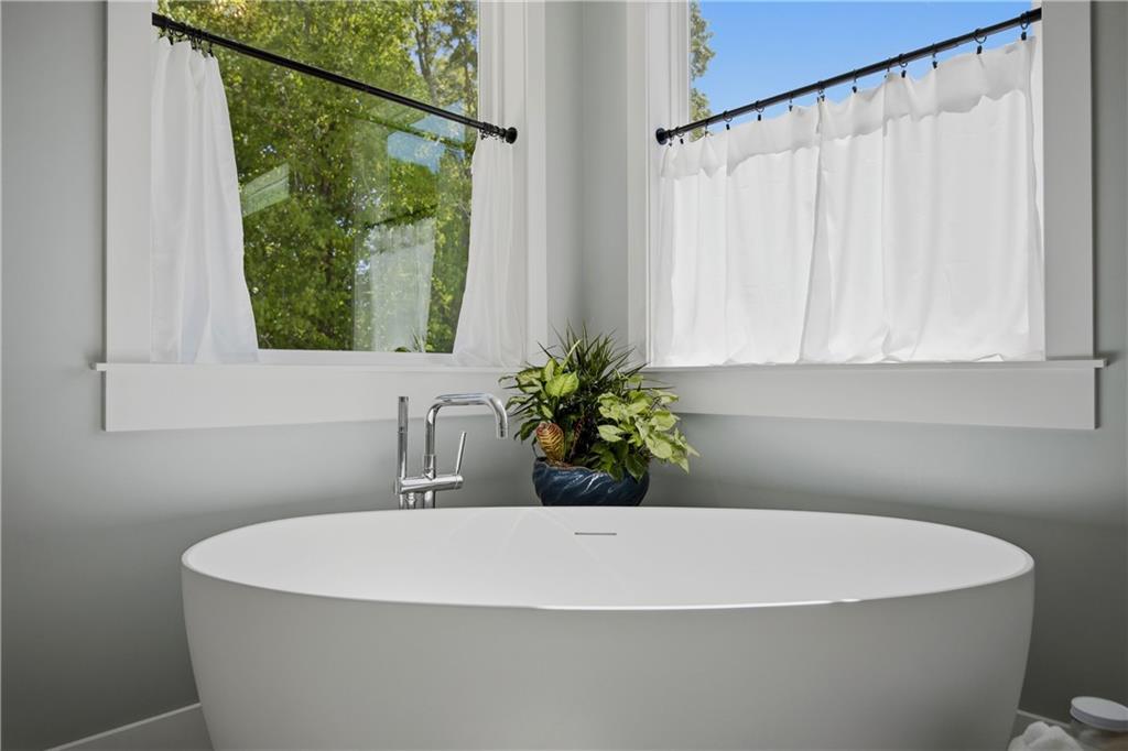 985 Whitehead Road Sugar Hill, GA 30518 - Photo 37 of 85 a white bath tub sitting next to a white window