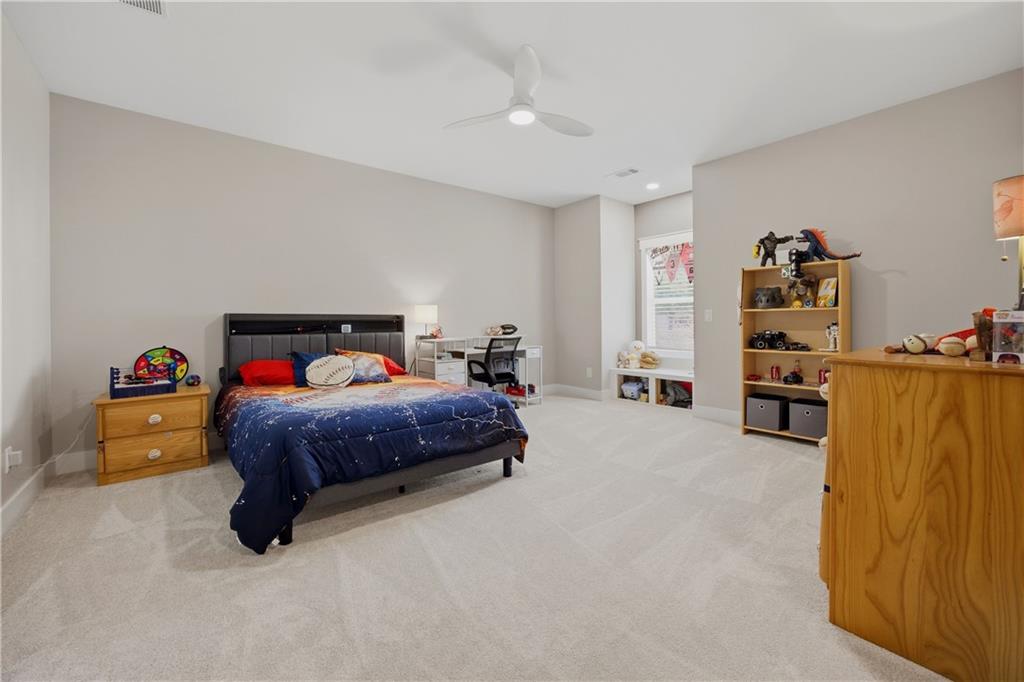 985 Whitehead Road Sugar Hill, GA 30518 - Photo 53 of 85 a bedroom with a bed and a walk in closet