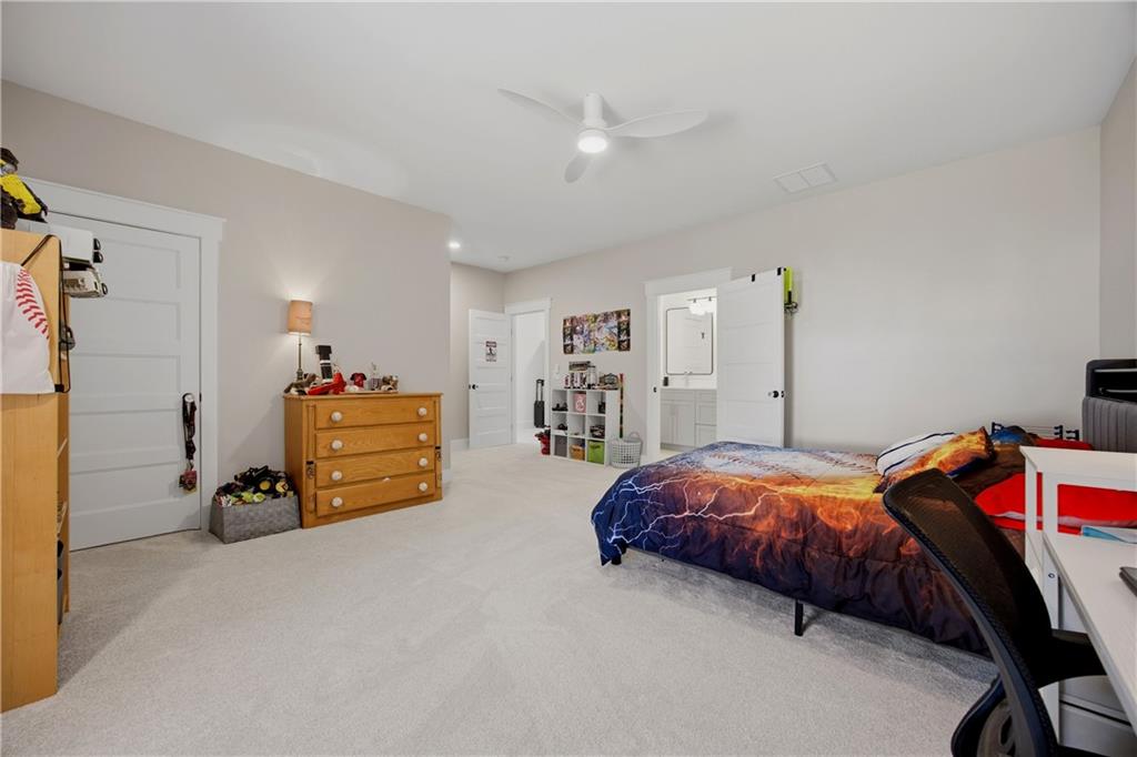 985 Whitehead Road Sugar Hill, GA 30518 - Photo 54 of 85 a bedroom with bed and a window
