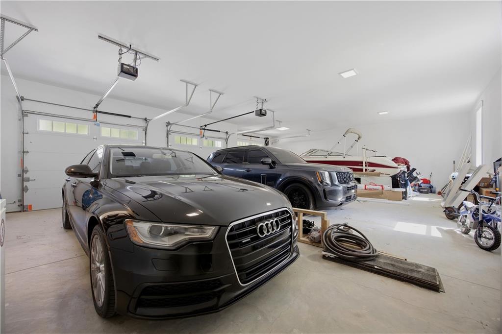985 Whitehead Road Sugar Hill, GA 30518 - Photo 62 of 85 a car parked in a garage