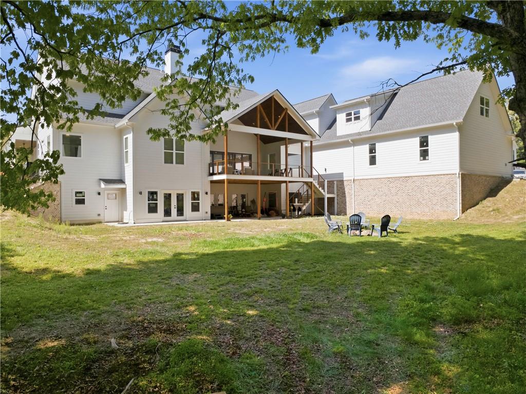 985 Whitehead Road Sugar Hill, GA 30518 - Photo 67 of 85 a front view of a house with a yard