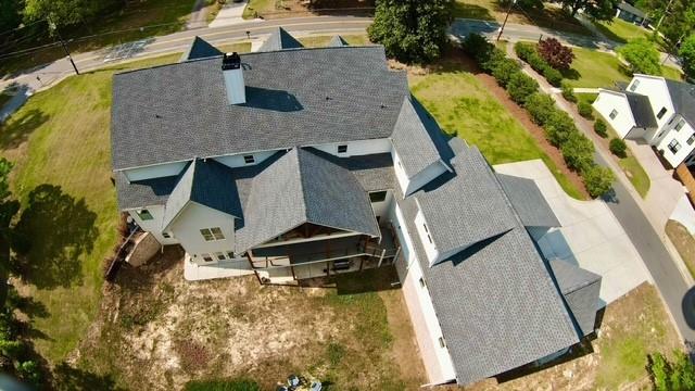 985 Whitehead Road Sugar Hill, GA 30518 - Photo 69 of 85 an aerial view of residential houses with outdoor space