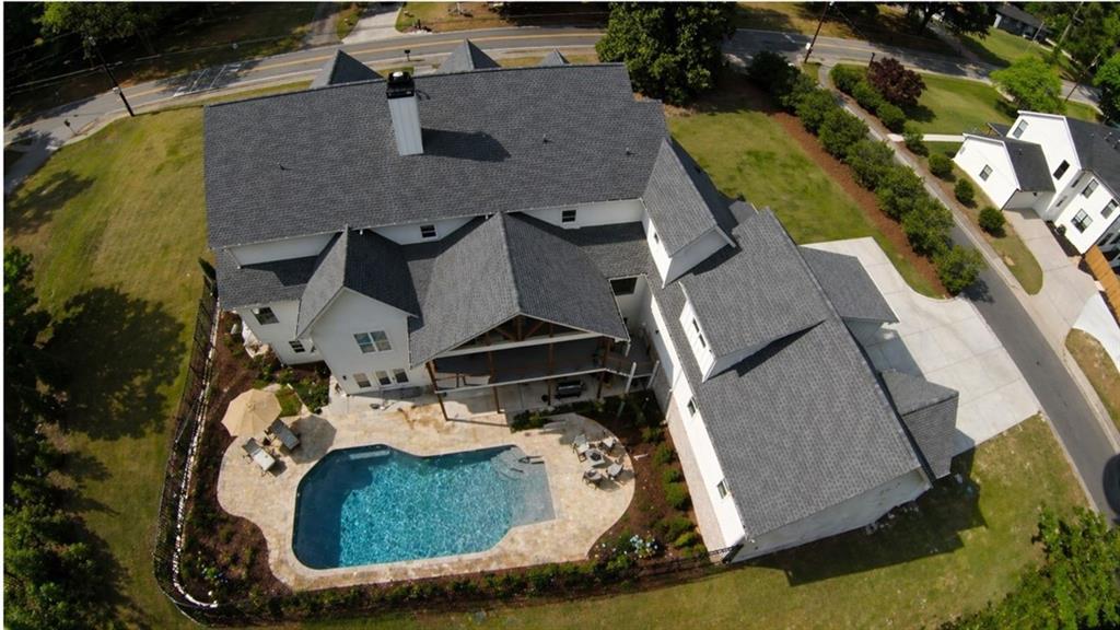 985 Whitehead Road Sugar Hill, GA 30518 - Photo 70 of 85 an aerial view of a house with a swimming pool