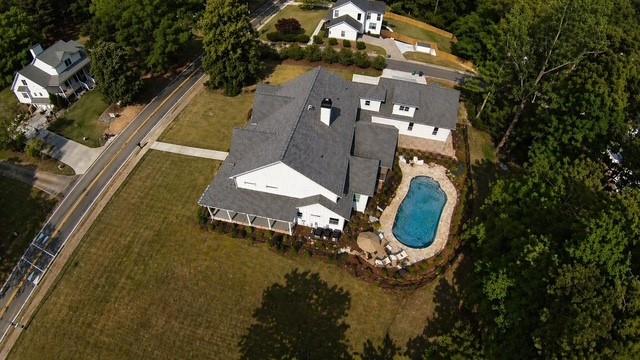 985 Whitehead Road Sugar Hill, GA 30518 - Photo 72 of 85 an aerial view of a house with a swimming pool
