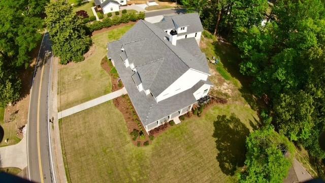 985 Whitehead Road Sugar Hill, GA 30518 - Photo 75 of 85 an aerial view of a residential apartment building with a yard