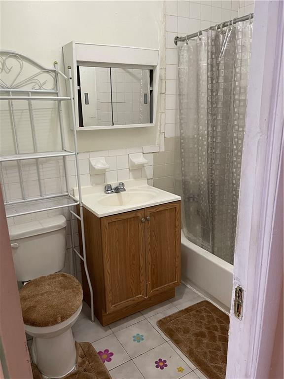 464 60th Street Brooklyn, NY 11220 - Photo 12 of 18 a bathroom with a sink toilet and shower