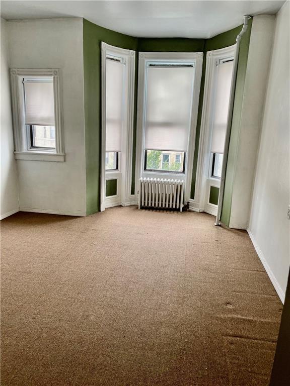 464 60th Street Brooklyn, NY 11220 - Photo 13 of 18 an empty room with windows