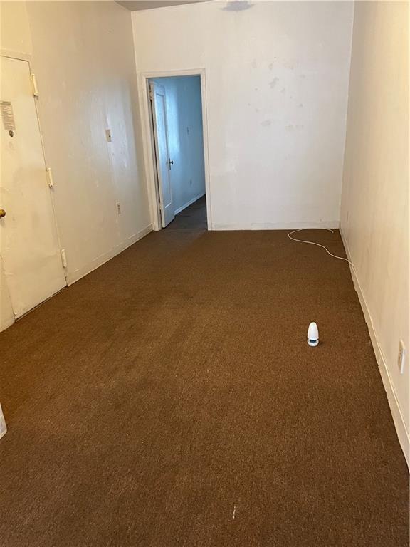 464 60th Street Brooklyn, NY 11220 - Photo 14 of 18 an empty room with windows