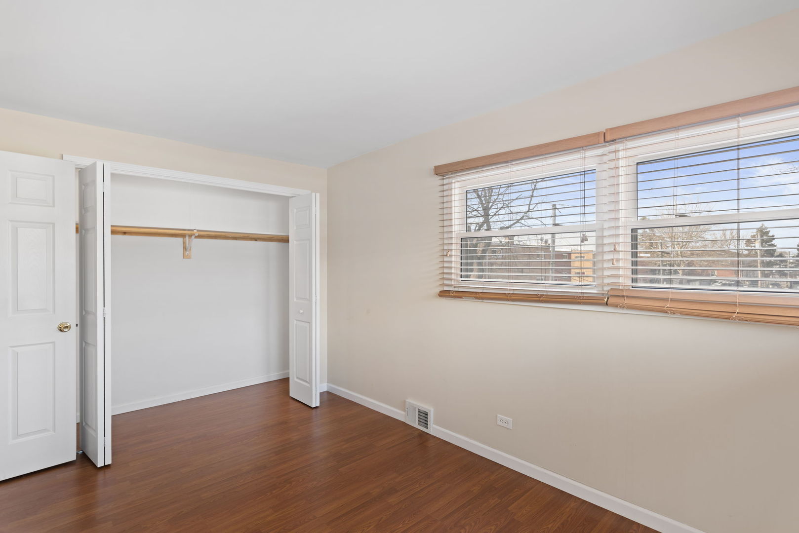 2011 Georgetown Lane Waukegan, IL 60085 - Photo 11 of 16 an empty room with wooden floor and windows