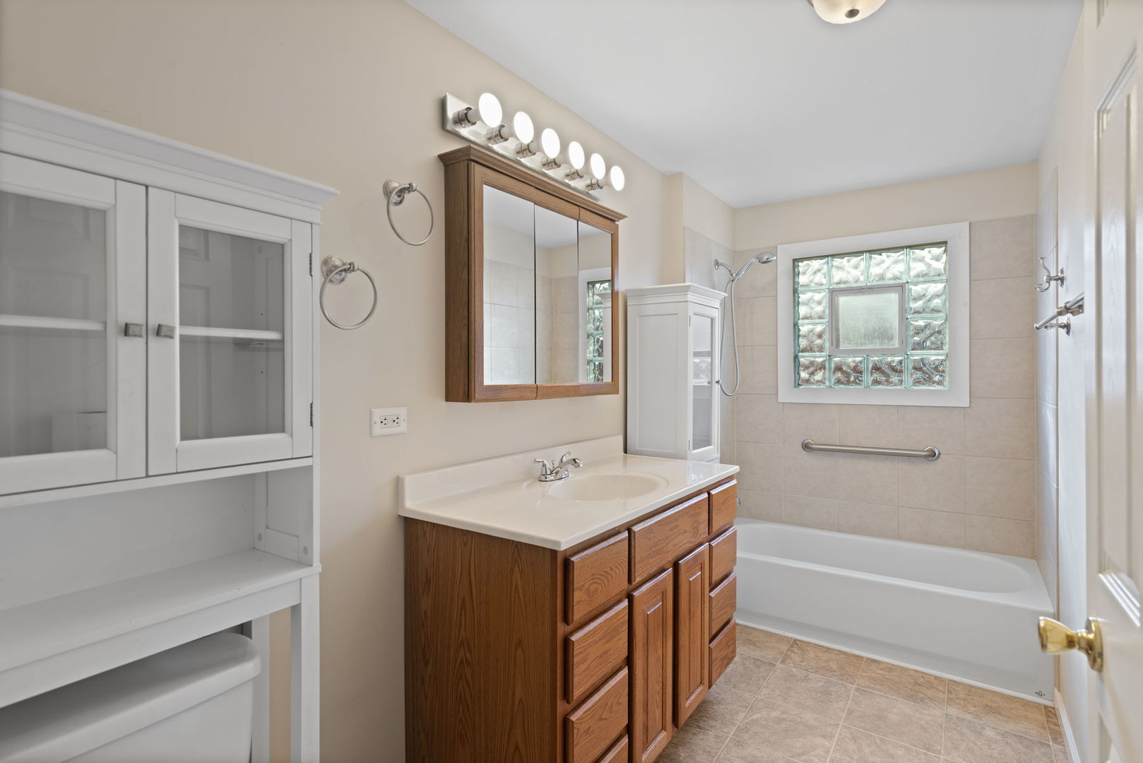 2011 Georgetown Lane Waukegan, IL 60085 - Photo 15 of 16 a bathroom with a sink vanity tub and a mirror