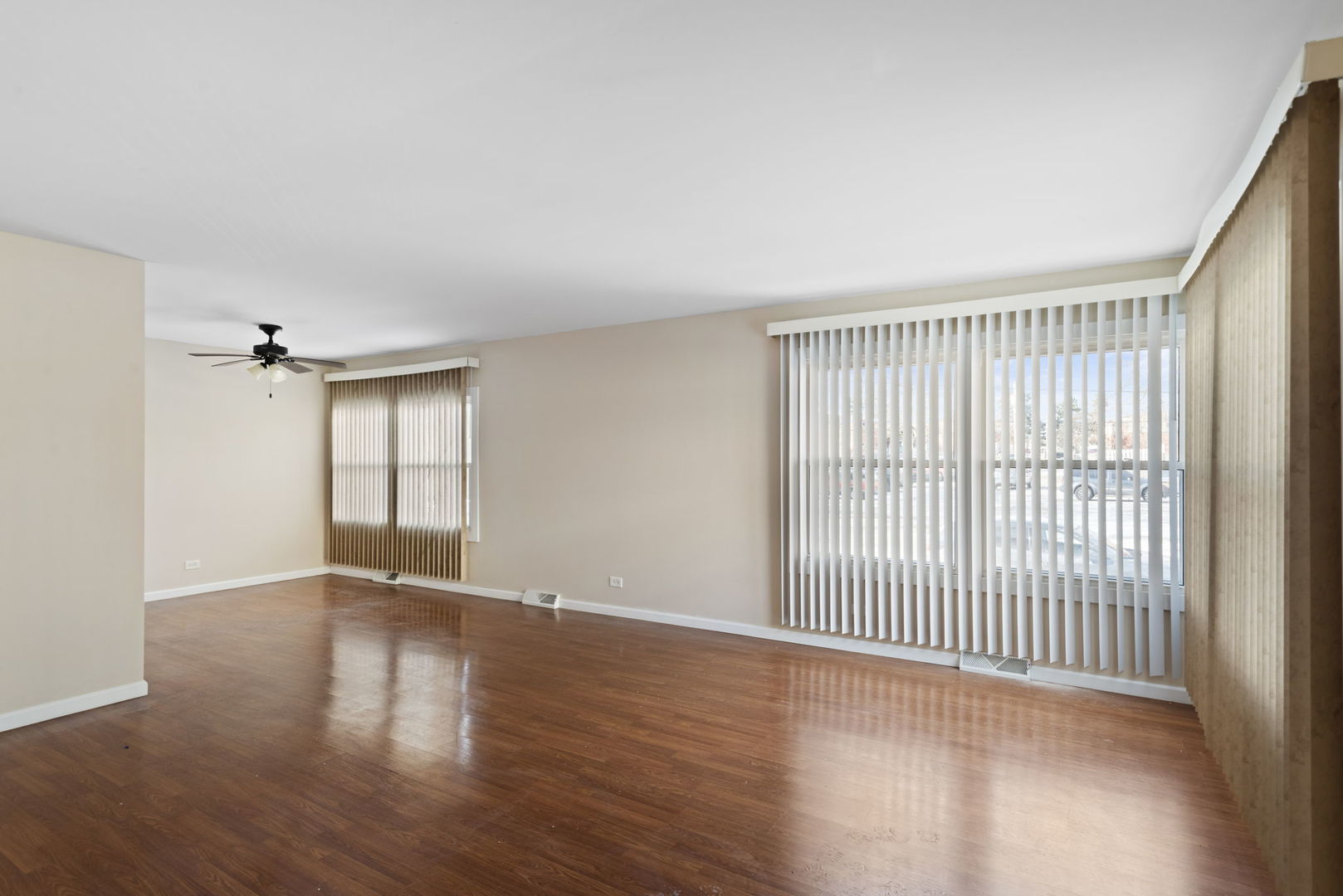 2011 Georgetown Lane Waukegan, IL 60085 - Photo 3 of 16 an empty room with wooden floor and windows