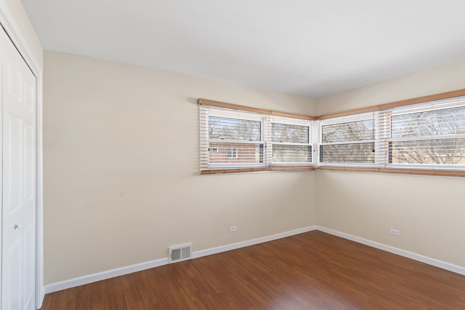 2011 Georgetown Lane Waukegan, IL 60085 - Photo 10 of 16 a view of an empty room with wooden floor and a window