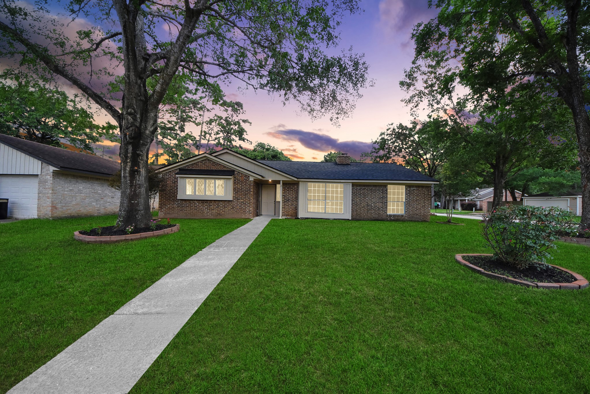 2402 Rolling Glen Drive Spring, TX 77373 - Photo 1 of 38 a front view of a house with a garden