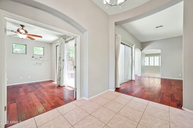 a view of a room with wooden floor and window