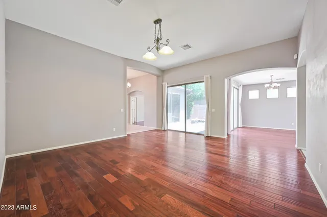 a view of livingroom with hardwood floor and ceiling fan