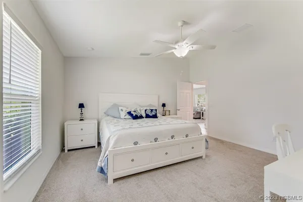 a room with a bed and a chandelier