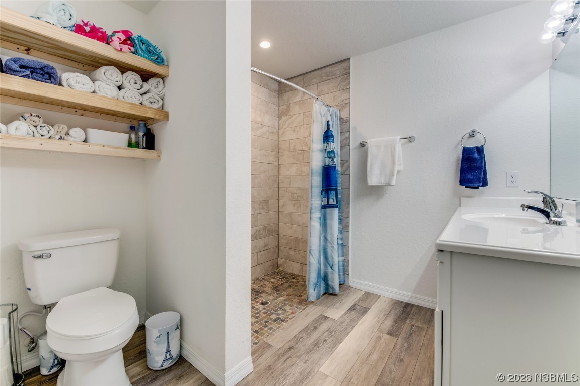 3129 Pine Tree Drive Edgewater, FL 32141 - Photo 16 of 34 a bathroom with a sink toilet and shower