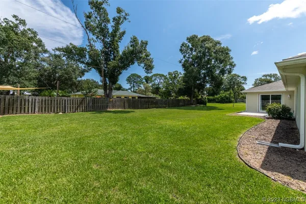 a view of a house with a big yard