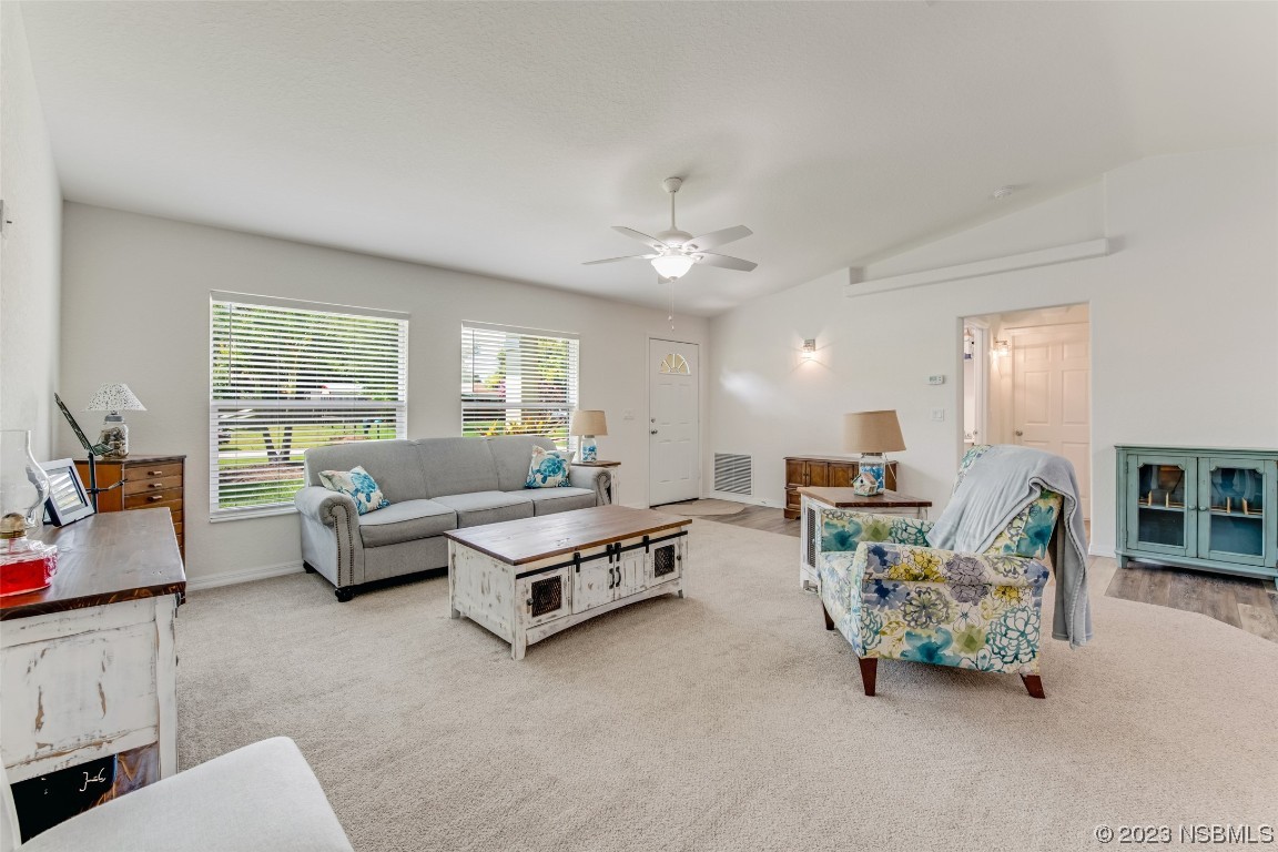 3129 Pine Tree Drive Edgewater, FL 32141 - Photo 4 of 34 a living room with furniture and a large window