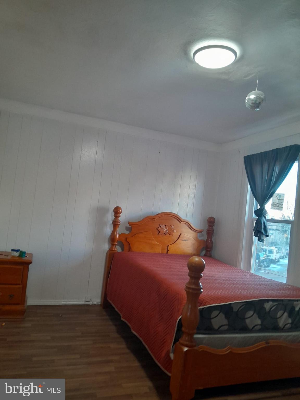 5005 Jackson Street Philadelphia, PA 19124 - Photo 11 of 11 a bedroom with a bed and window