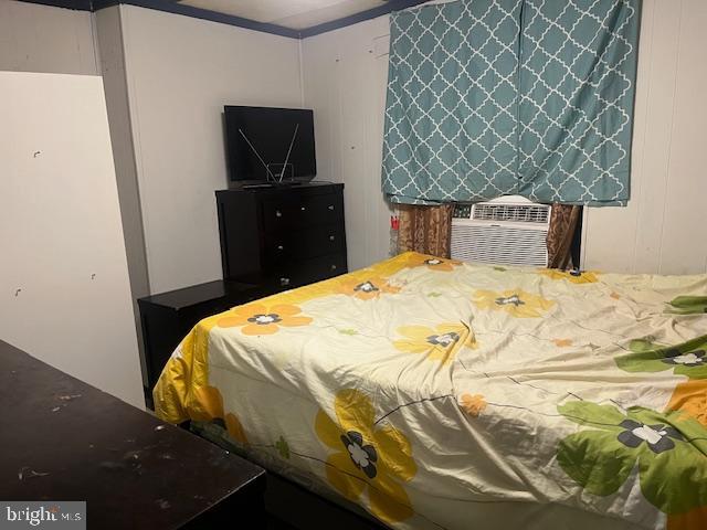 5005 Jackson Street Philadelphia, PA 19124 - Photo 5 of 11 a bedroom with a bed and chair