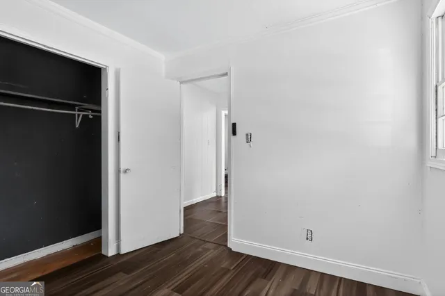 an empty room with wooden floor