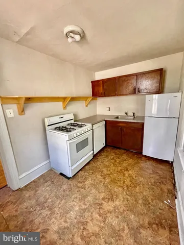 a view of kitchen and utility room