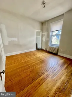 a kitchen with stainless steel appliances a stove and a refrigerator