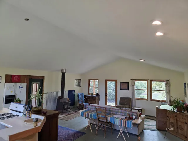 a view of a livingroom with furniture and window