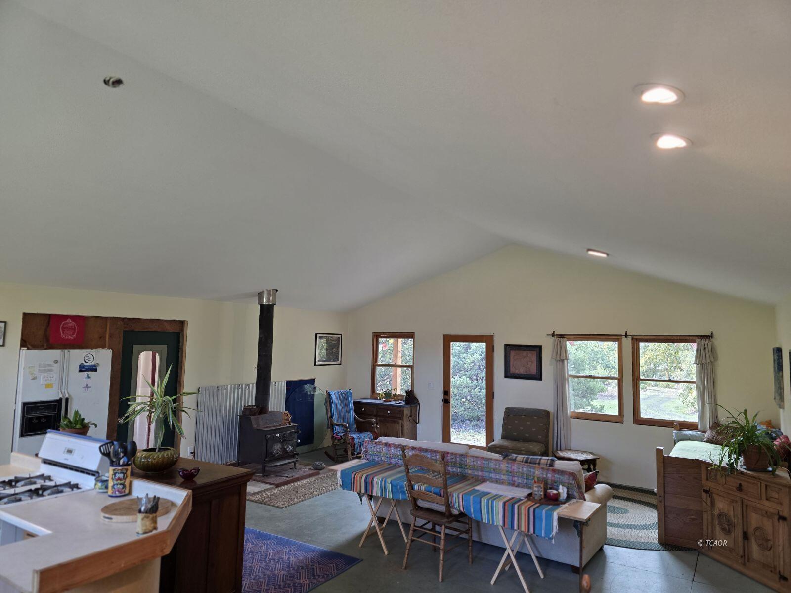 230 Corral Bottom Road Hyampom, CA 96046 - Photo 13 of 42 a view of a livingroom with furniture and window