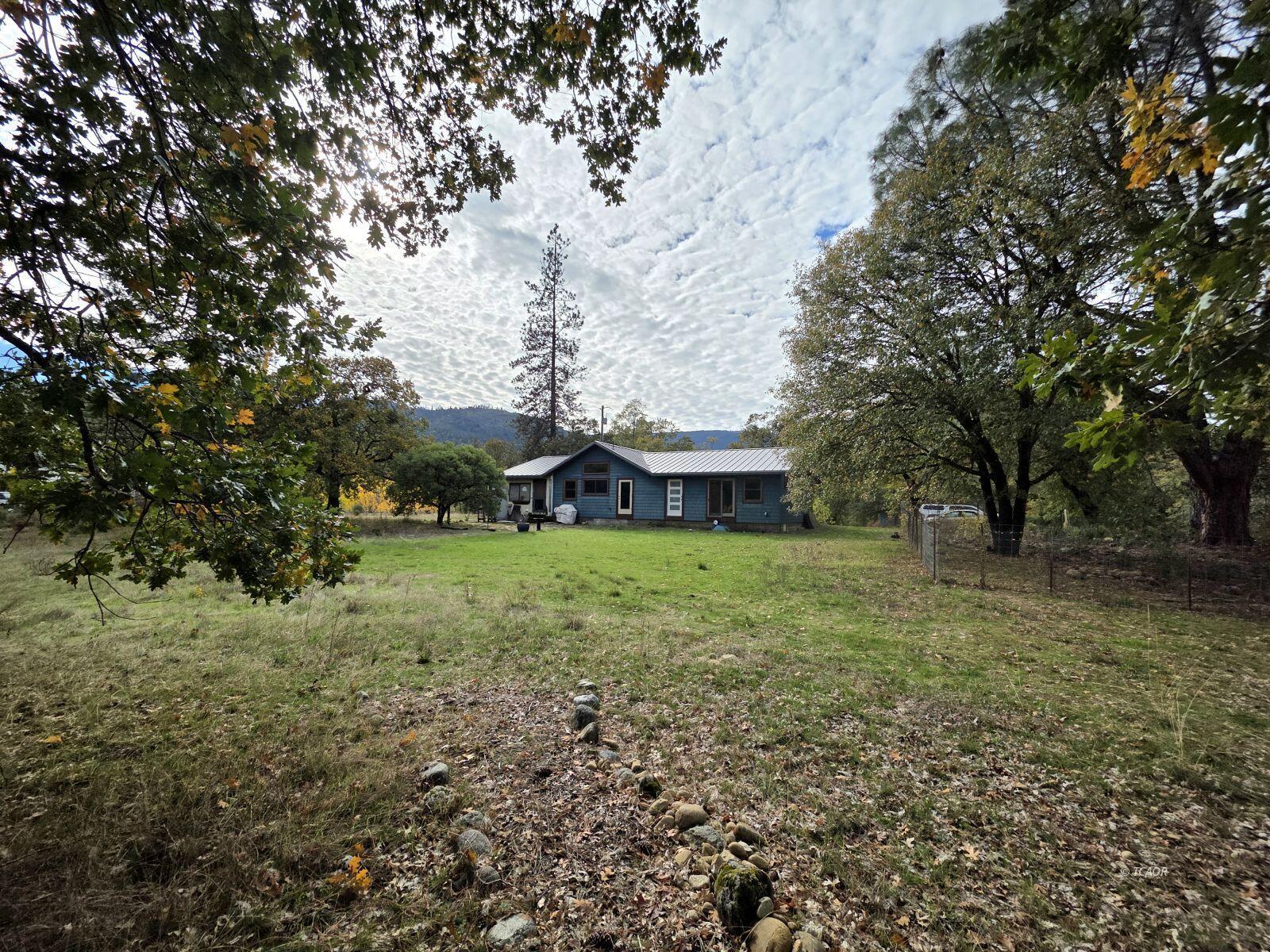 230 Corral Bottom Road Hyampom, CA 96046 - Photo 28 of 42 a view of a house with a yard