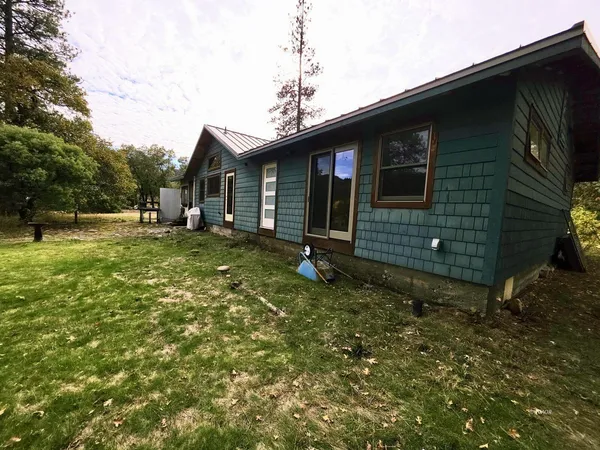 a backyard of a house with lots of green space