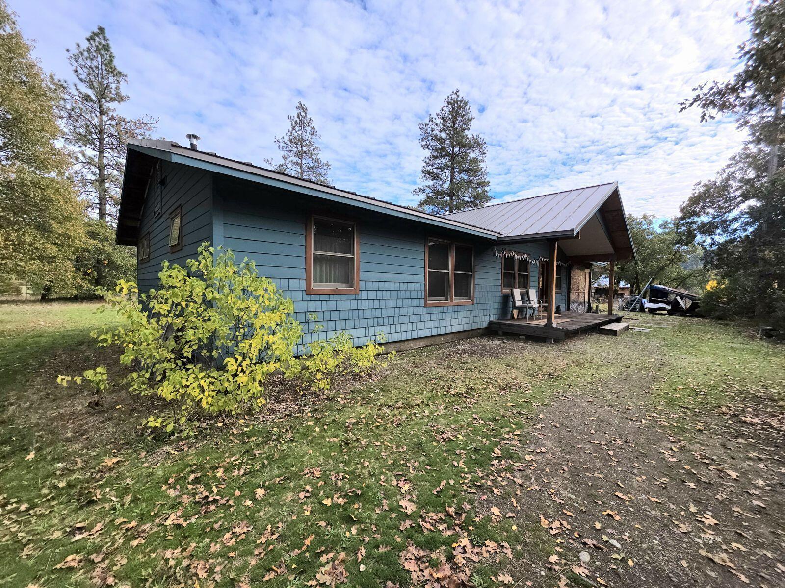 230 Corral Bottom Road Hyampom, CA 96046 - Photo 35 of 42 a front view of a house with garden