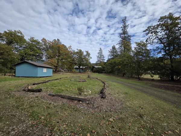 a backyard of a house with lots of green space