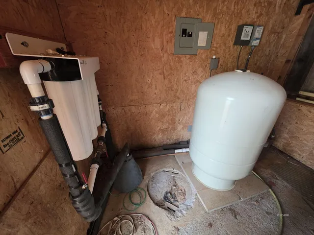 a bathroom with a toilet and a mirror