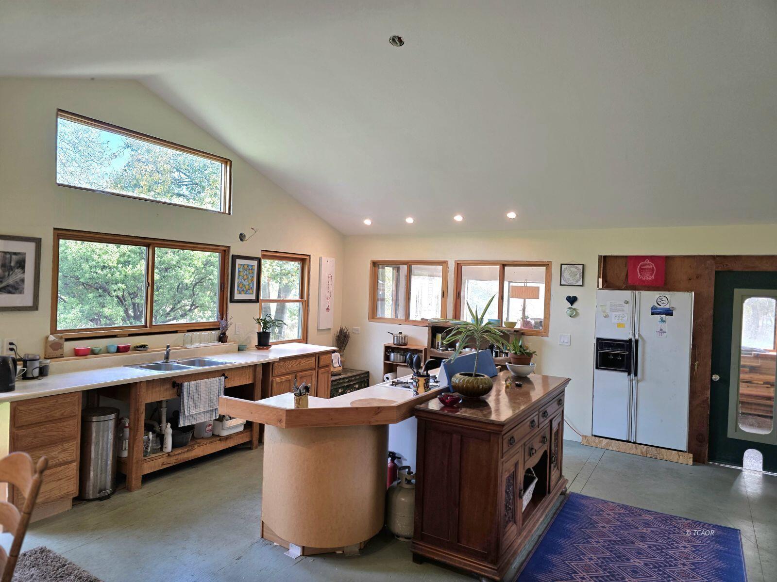 230 Corral Bottom Road Hyampom, CA 96046 - Photo 8 of 42 a living room with large window