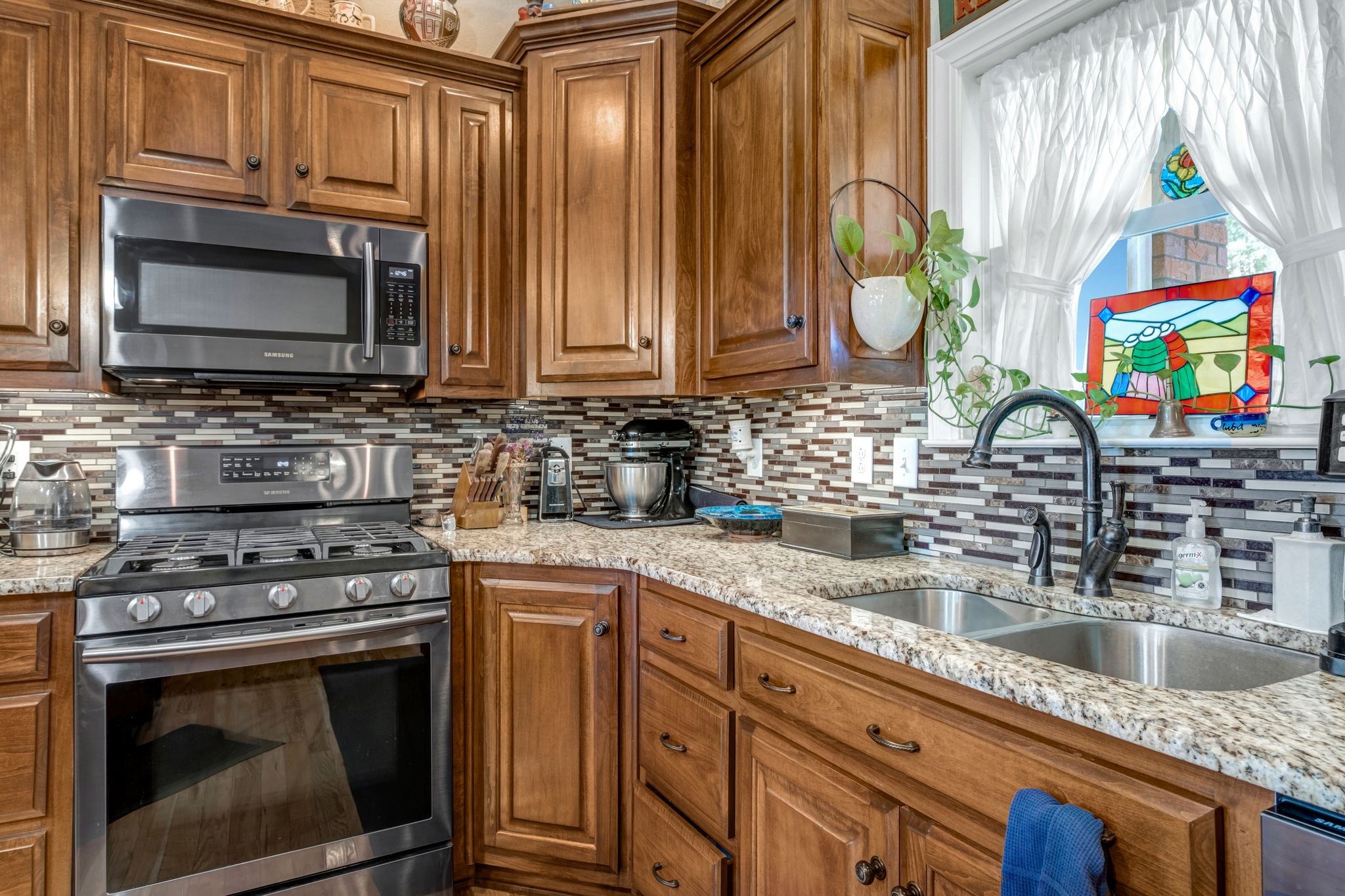 200 Hickory Ridge Lane Hartsville, TN 37074 - Photo 13 of 35 a kitchen with stainless steel appliances a stove a sink and a microwave