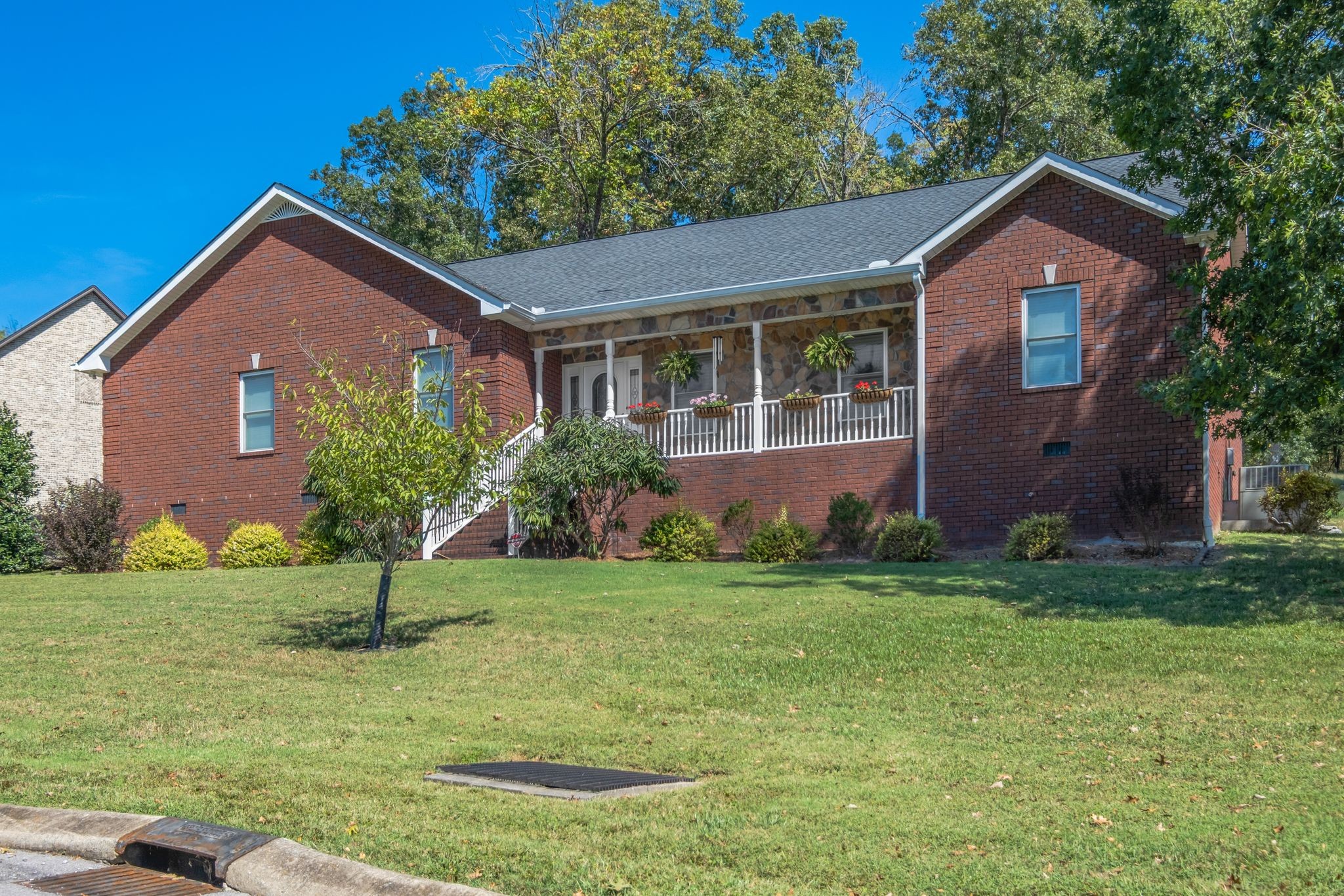 200 Hickory Ridge Lane Hartsville, TN 37074 - Photo 2 of 35 a front view of a house with a yard and garage