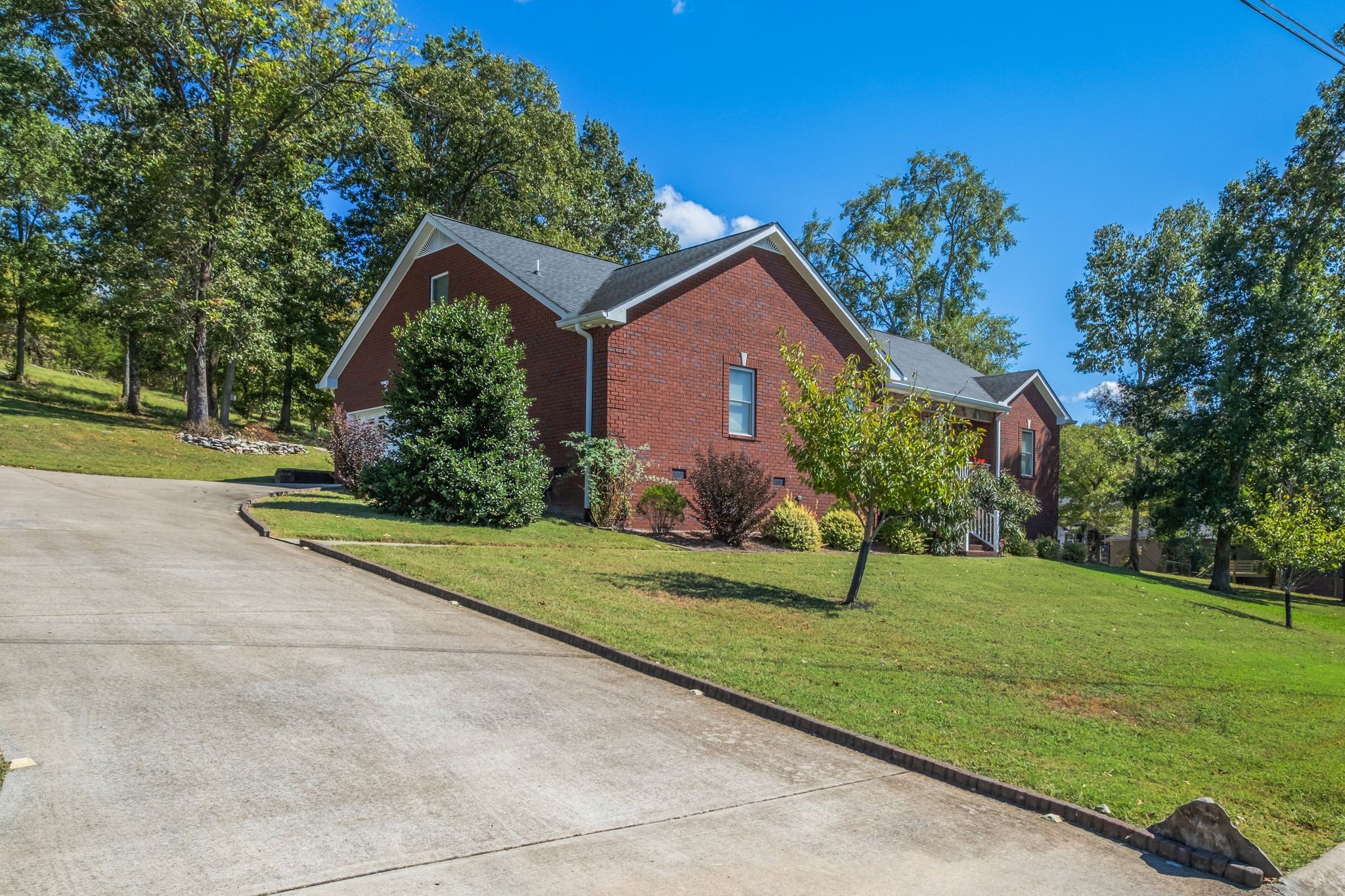 200 Hickory Ridge Lane Hartsville, TN 37074 - Photo 5 of 35 a front view of a house with a yard and potted plants