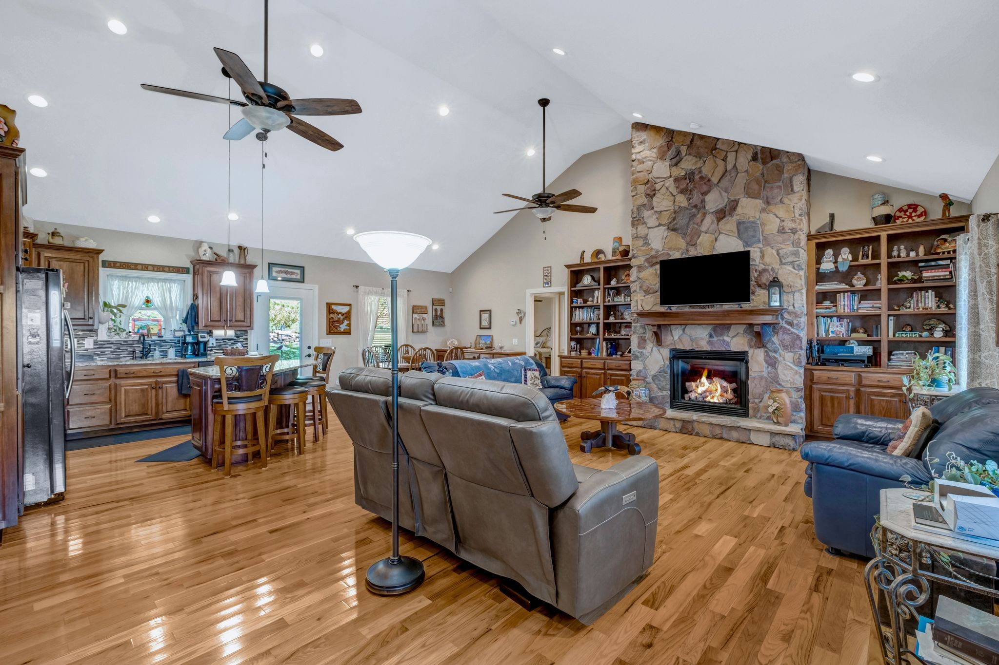 200 Hickory Ridge Lane Hartsville, TN 37074 - Photo 7 of 35 a living room with furniture a fireplace and a flat screen tv