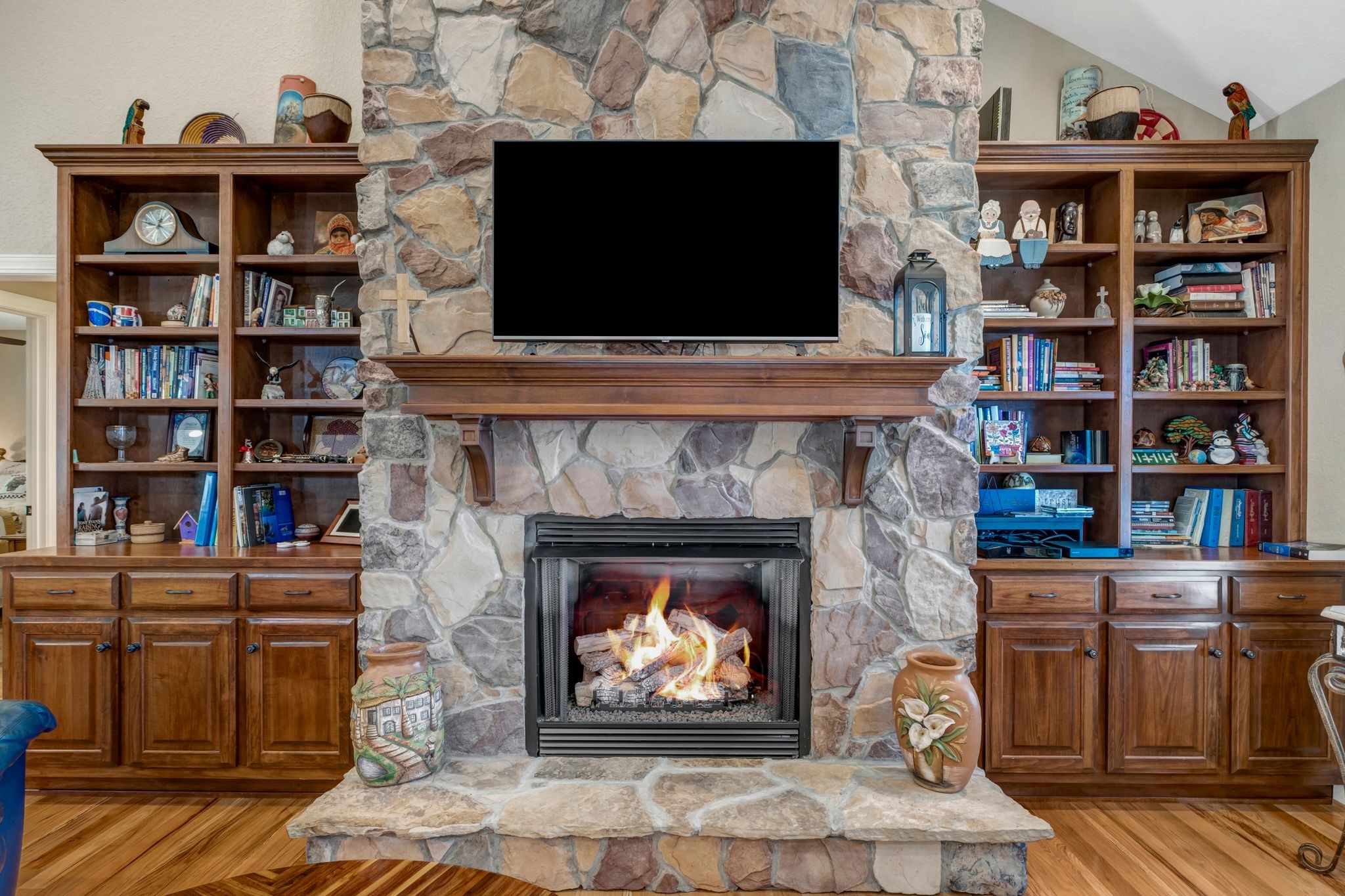200 Hickory Ridge Lane Hartsville, TN 37074 - Photo 9 of 35 a living room with a fireplace and a flat screen tv