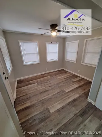 a view of an empty room with a window