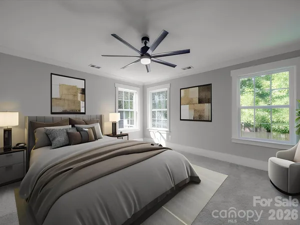 a bedroom with a large bed and a window