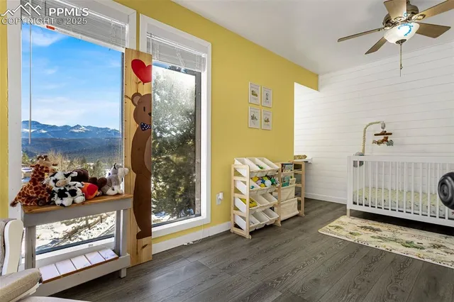 a en suite bathroom with a granite countertop sink and a mirror